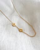 Initialen ketting 2 bedels geelgoud verguld uitgefreesde letters gftd. jewelry